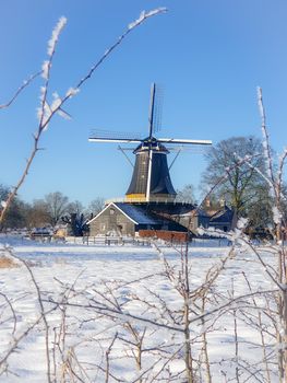 Pelmolen Ter Horst, Rijssen Netherlands during snowy weather snow covered wind mill
