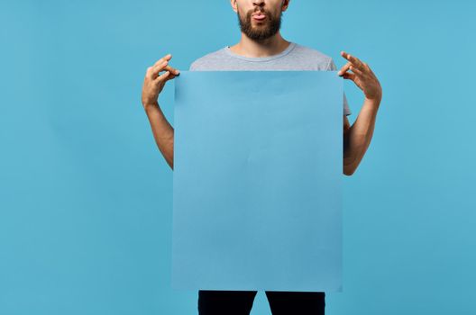 bearded man blue mockup poster presentation communication studio. High quality photo
