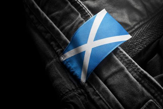 Tag on dark clothing in the form of the flag of the Scotland