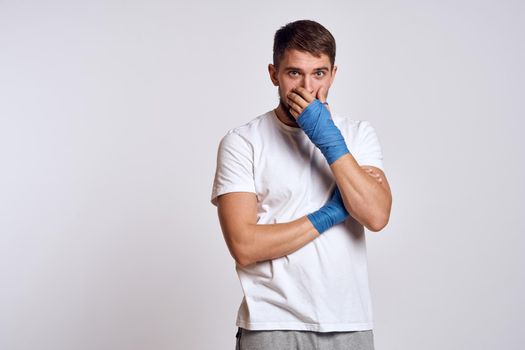Sports man boxing bandages on hands emotions energy workout