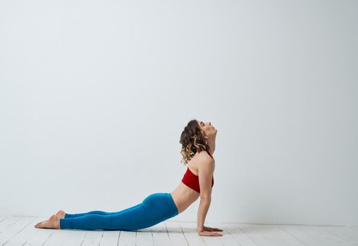 Woman doing gymnastics exercises yoga asana sportswear