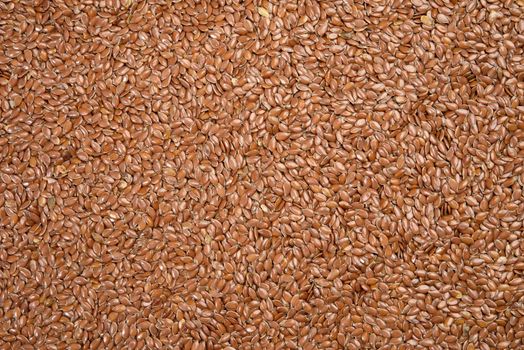 texture of dry brown flax seeds, top view