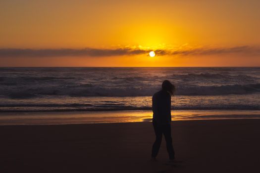 carefree woman dancing in the sunset on the beach. vacation vitality healthy living concept, Australia