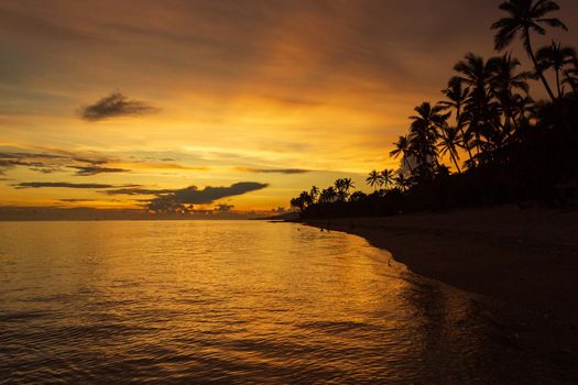 Colorful sunrise on Tambua Sands Beach on Fiji Island, Fiji
