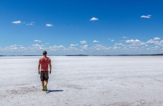 time to relax for a man walking on a salt lake in western australia