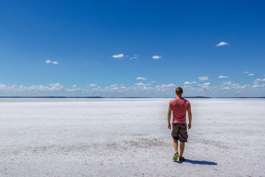 time to relax for a man walking on a salt lake in western australia
