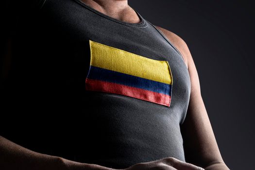 The national flag of Colombia on the athlete's chest