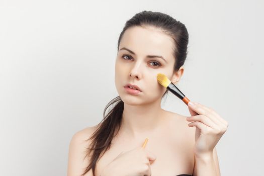 attractive brunette naked shoulders cosmetics skin care makeup