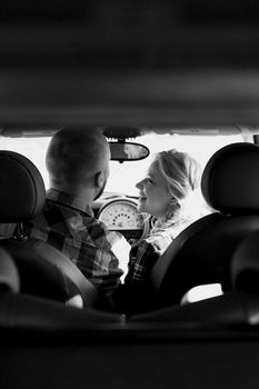 traveling by car of a young couple of a guy and a girl