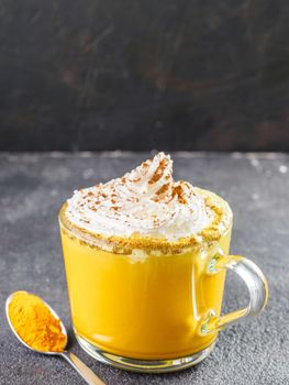 golden turmeric latte and ingredients, copy space
