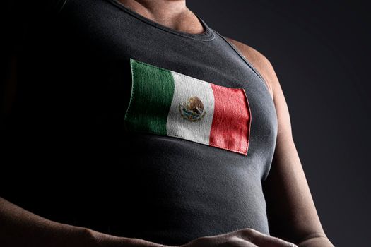 The national flag of Mexico on the athlete's chest