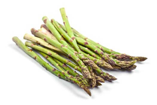 Bunch of fresh raw garden asparagus isolated on white background. Green spring vegetables. 