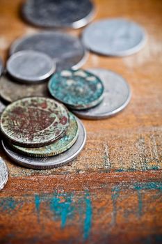 Pile of different ancient copper coins with patina.
