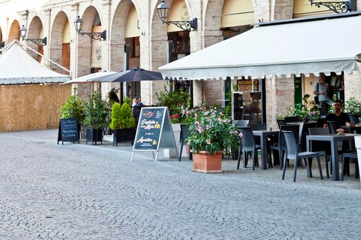 Fermo, Italy - June 23, 2019: Summer day and utdoor restaurant