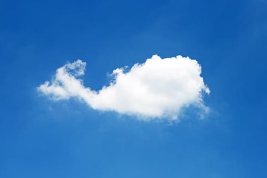 Blue sky background with cloud in the shape of a whale. Copy space