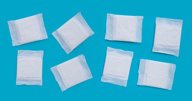 White sanitary pads on blue background.