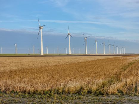 Windmill village indrustial wind mill by the lake Ijsselmeer Nehterlands