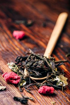 Wooden spoon of raspberry herbal tea