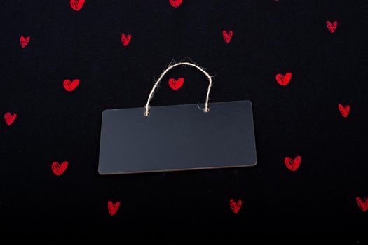 Rectangular shaped black notice board  and red hearts