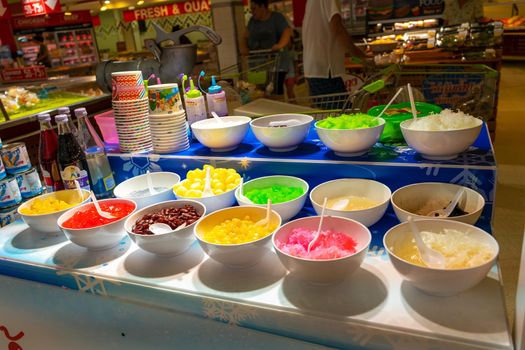 Street counter selling ice cream with different flavors