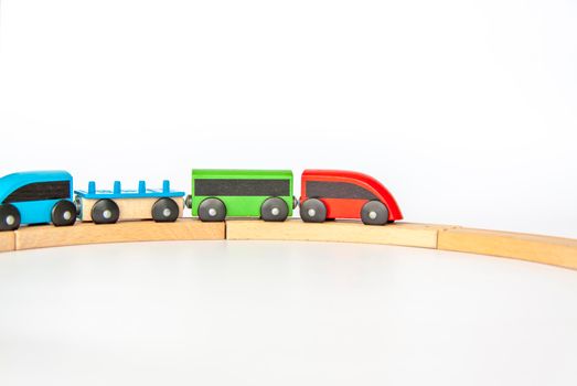 Children's railway made of wood on a white background.
