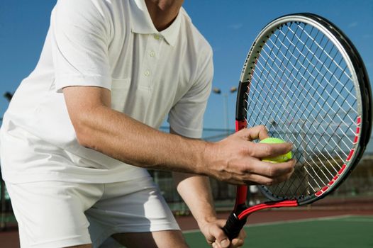Cropped photo of Man Playing Tennis