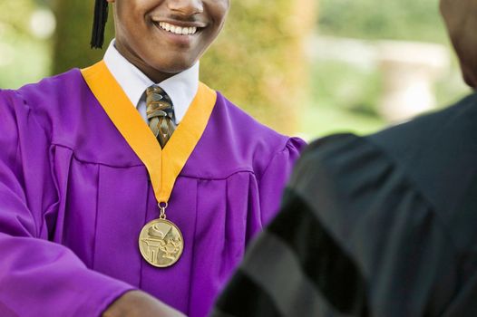 Cropped photo of Young Man Graduating with medal