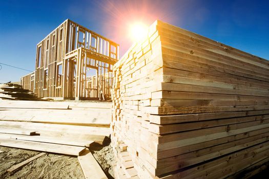 Construction Frame of a House with yellow lens flare