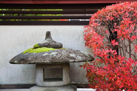 Japan Takayama Stone Lantern and bush in Autumn colors