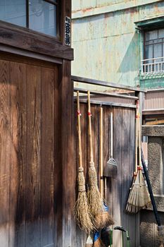 Straw Brooms on Fence at Shitaya Jinja Shinto Shrine