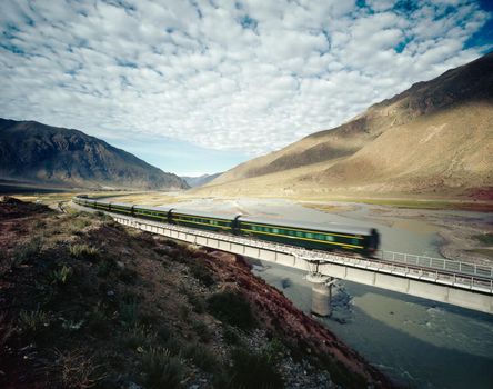 High Speed Train Traveling Through Valley