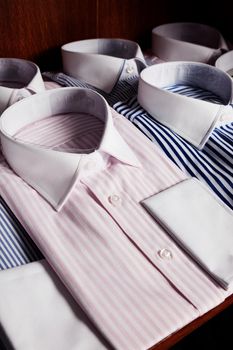 Shirts on shelves in tailor shop