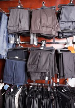 Trousers on hangers in tailor shop
