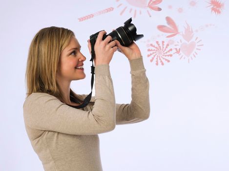 Female Photographer With Camera In Studio
