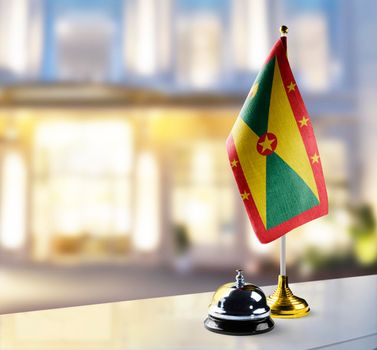 Grenada flag on the reception desk in the lobby of the hotel