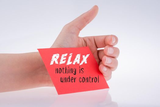 Relax wording written on paper in hand
