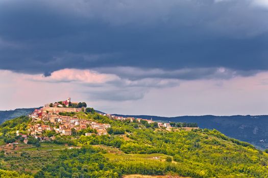 Historic town of Motovun on green hill view