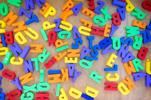 Alphabet learning concept: Close up of toy letters in the kindergarten 