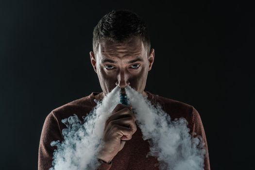 man smokes vape smoke Electronics vaping nicotine