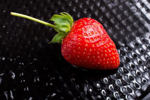 A juicy, sweet and ripe strawberry fruit