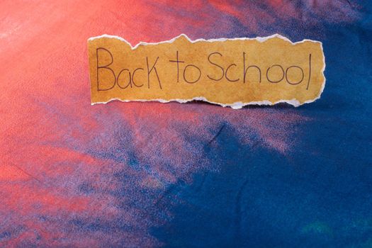 Back to school wording on  torn paper