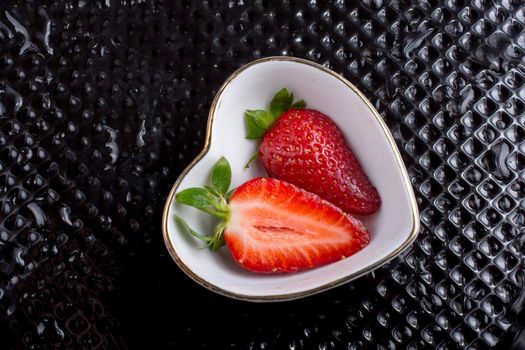 A juicy, sweet and ripe strawberry fruit in bowl