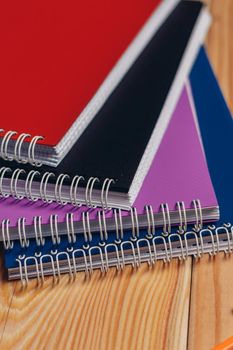 colorful notepads office wooden table paper work is education. High quality photo