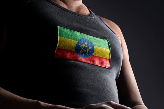 The national flag of Ethiopia on the athlete's chest