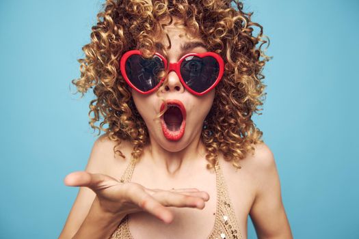 Cheerful woman Surprised facial expression open mouth curly hair