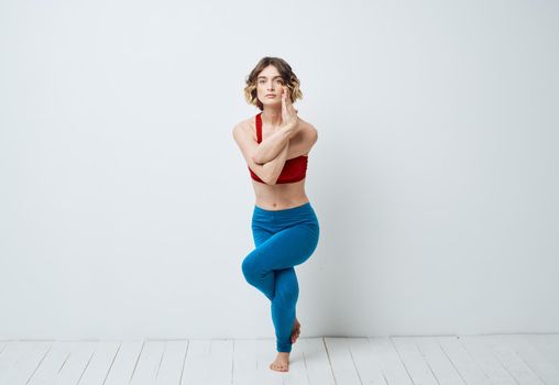woman in blue leggings gymnastics sport fitness yoga asana. High quality photo
