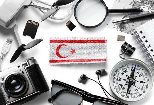 Flag of Northern Cyprus and travel accessories on a white background.