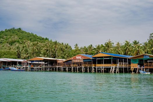 Koh Phitak , Chumphon province Thailand January 2020, fishing boats and small huts above the water, Koh Phitak a tradiional fishing village in Thailand