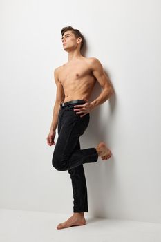 handsome male naked torso luxury black pants self-confidence model
