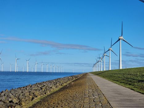 Windmill village indrustial wind mill by the lake Ijsselmeer Nehterlands